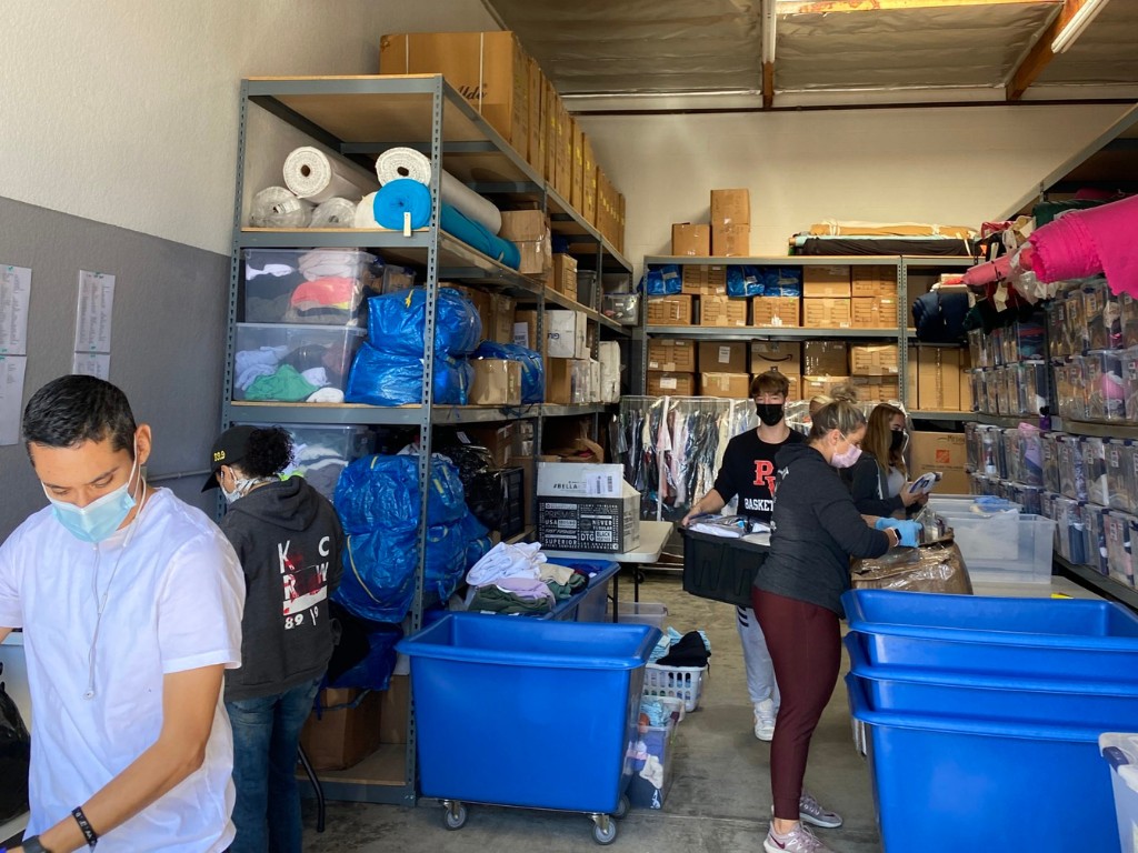 Image of people working at Project Ropa's warehouse