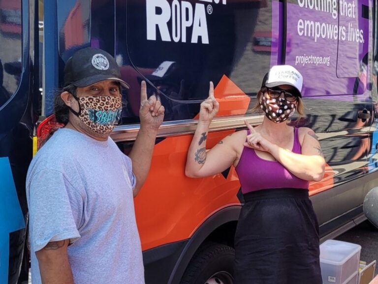 Community partners posing near Project Ropa's van.