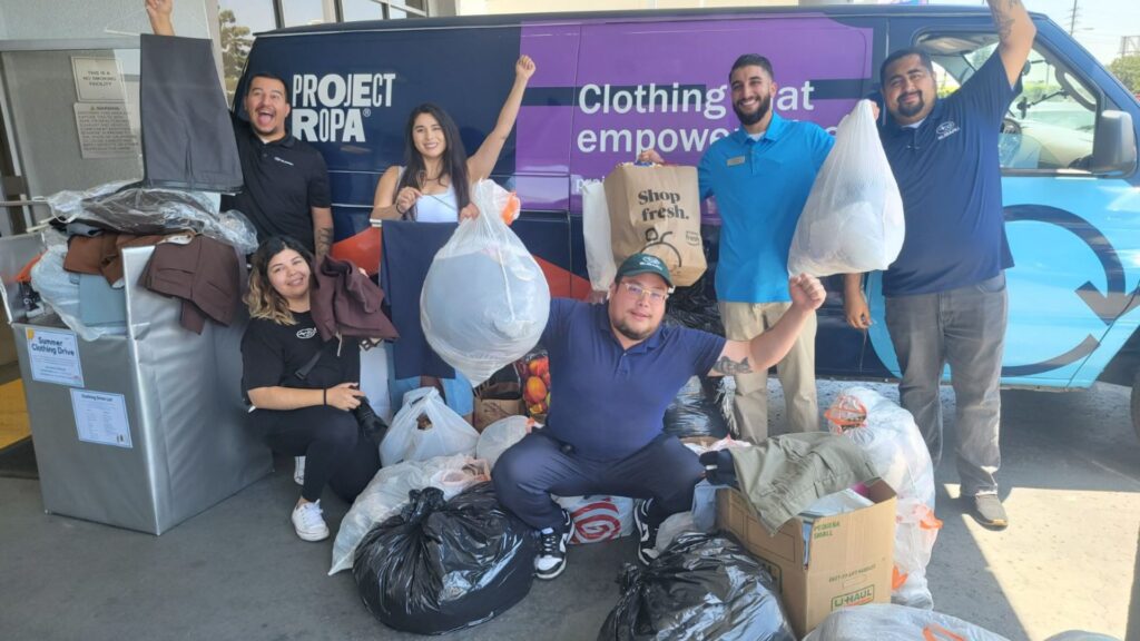 Clothing donation pick up from Sierra Subaru of Monrovia with staff posing near Project Ropa's van.